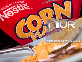 Nestle Corn Flakes logo on the packaging and a breakfast cereal are seen in this illustration photo taken in Sulkowice, Poland on August 12,...