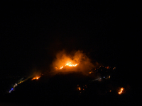 The flames of a vast fire, which broke out on Mount San Martino from 12.00 am on 12 August, in the evening between 12 and 13 the flames reac...