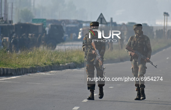 Indian army soldiers walk near the site of encounter in south Kashmir's Kulgam area, India on August 13, 2021. Inspector General of Police (...