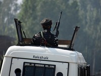 An Indian soldier keeping vigil near the site of encounter in south Kashmir's Kulgam area, India on August 13, 2021. Inspector General of Po...