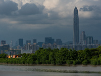  The Ping An tower in Shenzhen can be seen from Nam Sang Wai, the wetlands of Hong Kong.  On 15 August 2021, in Hong Kong, China. (
