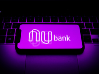 Nubank logo displayed on a phone screen is seen in this illustration photo taken in Krakow, Poland on August 17, 2021. (