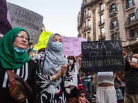 Protester is seen with a banner that says, enough with cultural relativism.Around a hundred women have participated in a feminist demonstra...