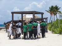Workers take preventive measures to avoid damage at the touristic places due to the arrival of Hurricane 