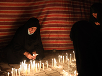 Muslims commemorate the night of loneliness (Lailatul Wahsha) in Karbala, Iraq, on August 17, 2021 by lighting candles as an expression of s...