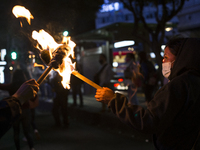 Members of the Aspirants Excluded from Higher Education Movement (MAES for its acronym in Spanish) marched with torches to demand that their...