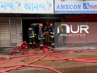 Firefighters try to extinguish a fire at a building at Bonani area in Dhaka, Bangladesh, on August 21, 2021. According to fire services, the...