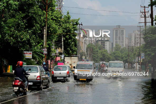 An ambulance moves through a flooded street after heavy rains in Ghaziabad, a suburb of New Delhi, India on August 21, 2021.  Intense rains...