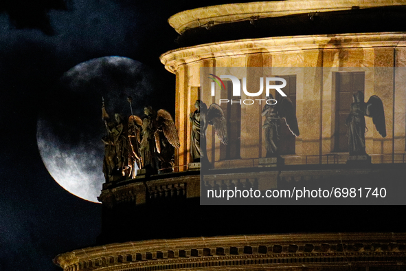 Full moon over St. Isaac's Cathedral in St. Petersburg. St. Petersburg, Russia 21, August 2021 