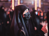 Muslims take part at the procession of Bani Asad goes out to mourn in Karbala, on the anniversary of the burial of the body of Imam Hussein,...