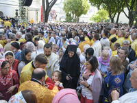 The sacrament of Holy Communion during a religious service close to the St. Sophia Cathedral in Kyiv, Ukraine August 22, 2021 (