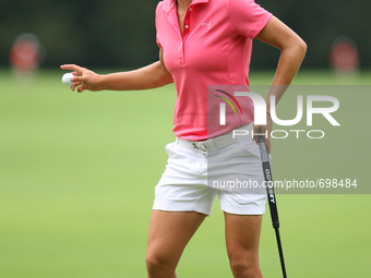 Dewi Claire Schreeful of Diepenveen, The Netherlands greets the gallery after making her putt on the 17th green during the third round of th...