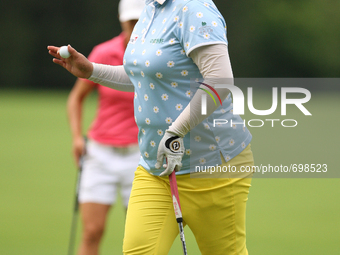 Shanshan Feng of Guangzhou, China greets the gallery after making her putt on the 17th green during the third round of the Marathon LPGA Cla...