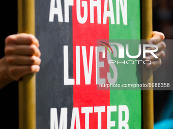 A banner 'Afghan Lives Matter' is seen during a protest In Solidarity With Afghanistan in front of the U.S. Consulate General in Krakow, Pol...
