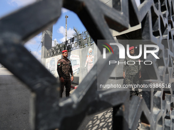 Members of Palestinan security forces stand guard at the closed off Rafah border crossing to Egypt in the southern Gaza Strip, on August 23,...