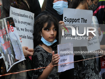 Children belonging to Afghan nationals living in Delhi protest outside the United Nation High Commissioner for Refugees (UNHCR) office appea...