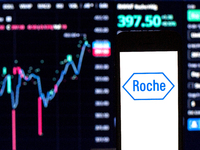 In this photo illustration a Hoffmann–La Roche logo seen displayed on a smartphone with the stock market information of Hoffmann–La Roche in...