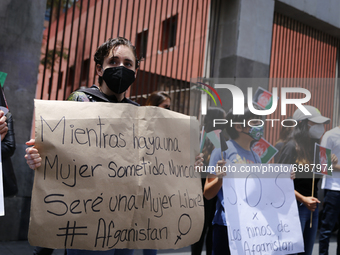A woman protests on August 23, 2020 in Mexico City, Mexico. Women protest outside the Secretaria de Relaciones Exteriores (SRE) to ask the M...