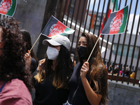 A woman hols an Afghanistan flag to protest on August 23, 2020 in Mexico City, Mexico. Women protest outside the Secretaria de Relaciones Ex...