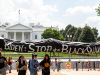 A black snake symbolizing oil pipelines arrives at the White House  during a protest against Enbridge's Line 3 pipeline sponsored by Shut Do...