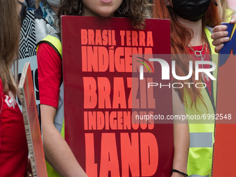 LONDON, UNITED KINGDOM - AUGUST 25, 2021: Activists and campaigners protest near Brazilian Embassy in solidarity with the Indigenous peoples...