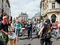 Extinction Rebellion protesters return to London, UK, on August 25, 2021 on day three of their 'Impossible Rebellion' series of actions. Beg...