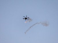 An Israeli drone dropping tear-gas grenades during the clashes near the border between Israel and Gaza Strip, in the eastern Khan Younis tow...