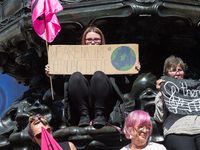 LONDON, UNITED KINGDOM - AUGUST 25, 2021: Environmental activists from Extinction Rebellion gather in Piccadilly Circus on the third day of...