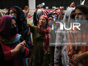 An Afghan woman reacts as she takes part in a protest outside the United Nation High Commissioner for Refugees (UNHCR) office appealing inte...
