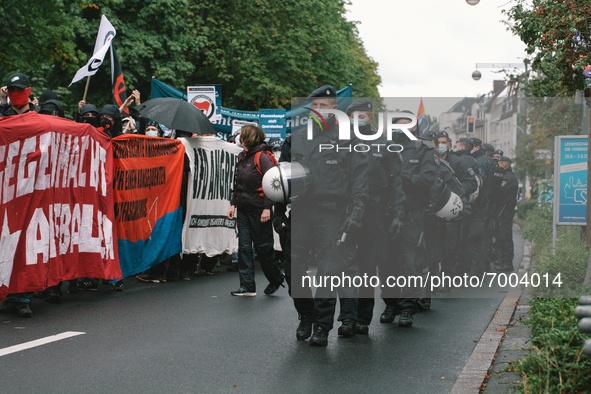 Polices are seen walking side by side with protesters during the protest over Assembly Act NRW in Duesseldorf, Germany on August 28, 2021 