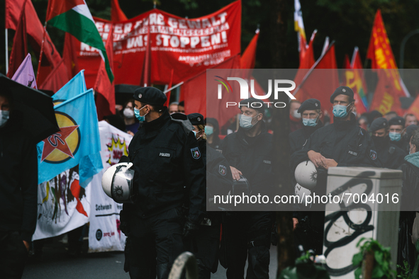 Polices are seen walking side by side with protesters during the protest over Assembly Act NRW in Duesseldorf, Germany on August 28, 2021 