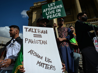 Members of the local Afghan diaspora, activists and local supporters seen in front of the Alberta Legislature Building during the STOP KILLI...