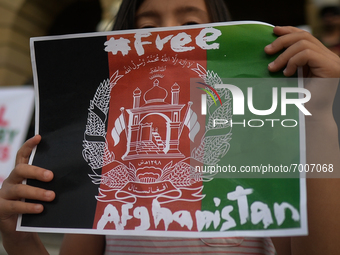 A young protester holds a placard that reads 'Free Afganistan'.
Members of the local Afghan diaspora, activists and local supporters seen in...