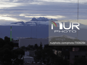 View of Iztaccihuatl Volcano during sunrise and COVID-19 health emergency in Mexico. (