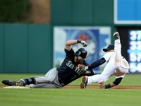 Detroit Tigers short stop Jose Iglesias, right, tags Seattle Mariners Seth Smith out at second during the fourth inning of a baseball game i...