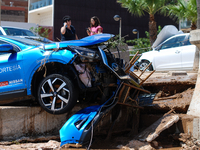 A car damaged by floods on street filled with mud and derbis the day after flash floods on September 2, 2021 in Les Cases dAlcanar, Spain.
T...