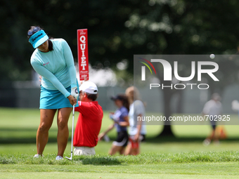 Jenny Suh of Fairfax, Virginia hits from the fairway toward the 10th green during the first round of the Meijer LPGA Classic golf tournament...