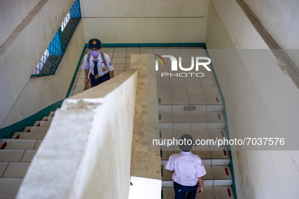 The students climb the stairs of the school keeping their distance, in South Tangerang, Indonesia, on September 6, 2021. Indonesia governmen...