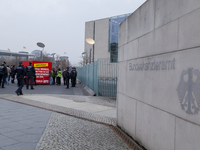 Greenpeace protesters against the German Energy politic, in Berlin, on April 1, 2014. They blockaded the entry of the Chancellery with a cub...