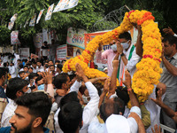 Congress leader and Former State President Sachin Pilot being garlanded by his supporters during his 44th birthday celebration, outside his...