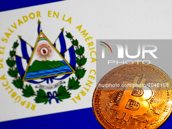 Representation of Bitcoin cryptocurrency and El Salvador flag displayed on a laptop screen are seen in this illustration photo taken in Krak...