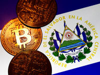 Representation of Bitcoin cryptocurrency and El Salvador flag displayed on a laptop screen are seen in this illustration photo taken in Krak...