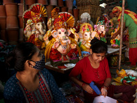 Artisans prepare idols of the elephant-headed Hindu god Ganesha ahead of the Ganesh Chaturthi festival, at a workshop in New Delhi, India on...