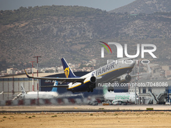 A Boeing 737-800 jet aircraft of the low cost budget carrier Ryanair - Malta Air with registration 9H-QBI as seen departing from Athens Inte...