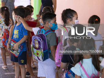 Children in a queue before entering to the classroom during the new opening of the Primary School Year at CEIP Mariana Pineda Public School...