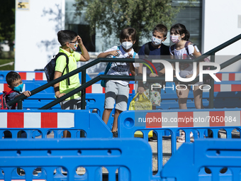 Children with face masks and backpacks during the new opening of the Primary School Year at CEIP Mariana Pineda Public School in Huetor Vega...