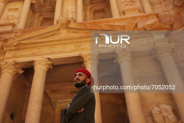 A Jordanian Bedouin looks at tourists near the treasury in the ancient city of Petra. Jordan, Friday, September 10, 2021 