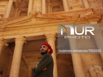 A Jordanian Bedouin looks at tourists near the treasury in the ancient city of Petra. Jordan, Friday, September 10, 2021 (
