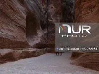 Tourists walk along the Siq in the ancient city of Petra. Jordan, Friday, September 10, 2021
 (