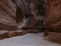 Tourists walk along the Siq in the ancient city of Petra. Jordan, Friday, September 10, 2021
 (